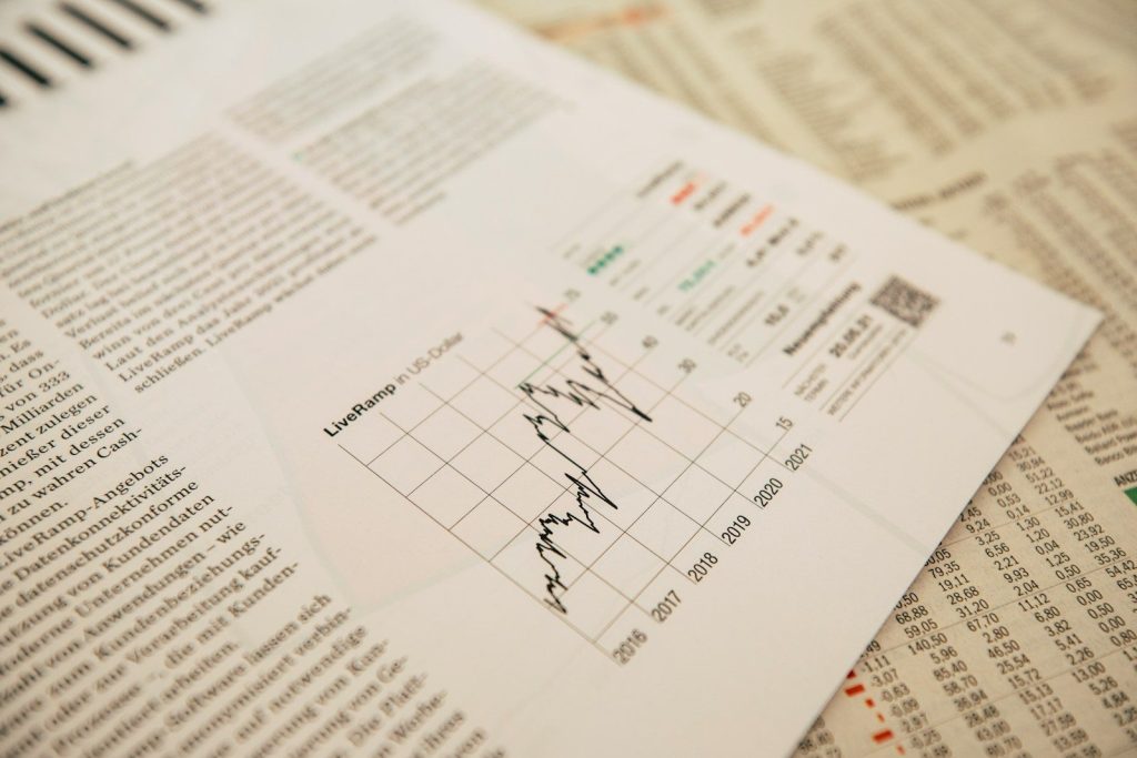 financial newspaper with stock chart