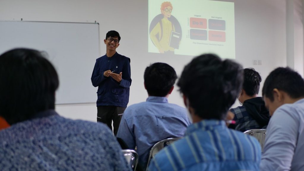 a man standing in front of a group of people
