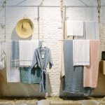 assorted-color towels hanging inside room