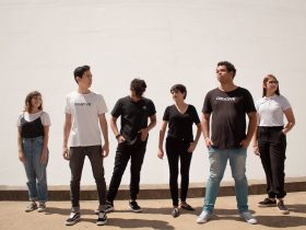 group of people standing on brown floor