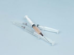 white and clear plastic syringe