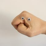 person holding brown heart shaped bread