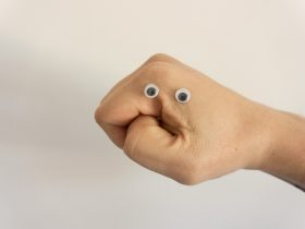 person holding brown heart shaped bread