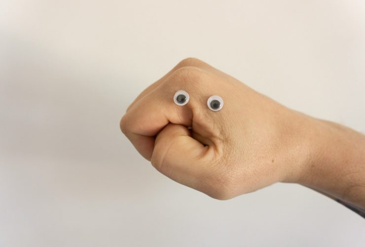 person holding brown heart shaped bread