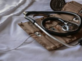 black stethoscope with brown leather case
