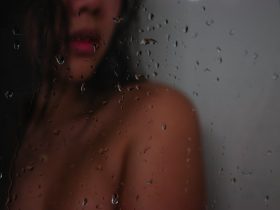 topless woman in shower room