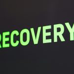 a close up of a sign that reads recovery