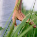persons feet on green grass