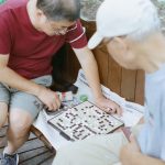 a group of people playing a board game
