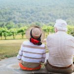 couple sitting on pathway