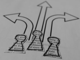a close up of a piece of paper with arrows
