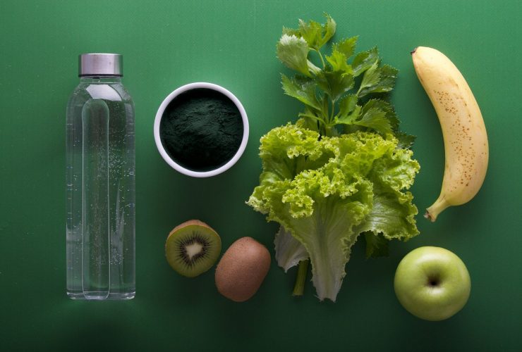 assorted fruits and vegetables on green surface