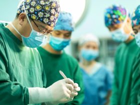 A group of doctors standing around each other